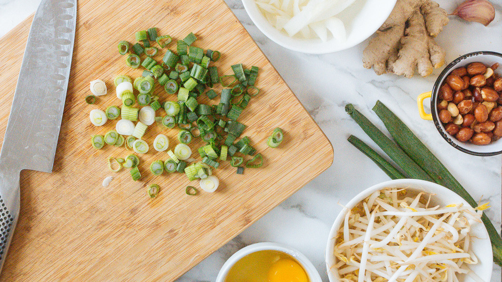 diced scallions on cutting board