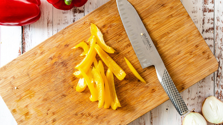 slicing pepper on cutting board