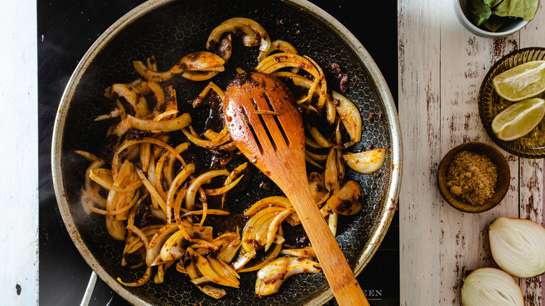 onions in pan curry paste