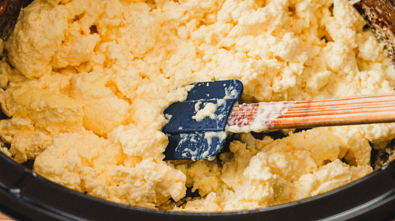 scrambling eggs with spatula