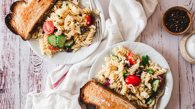 two plates of Mediterranean pasta salad