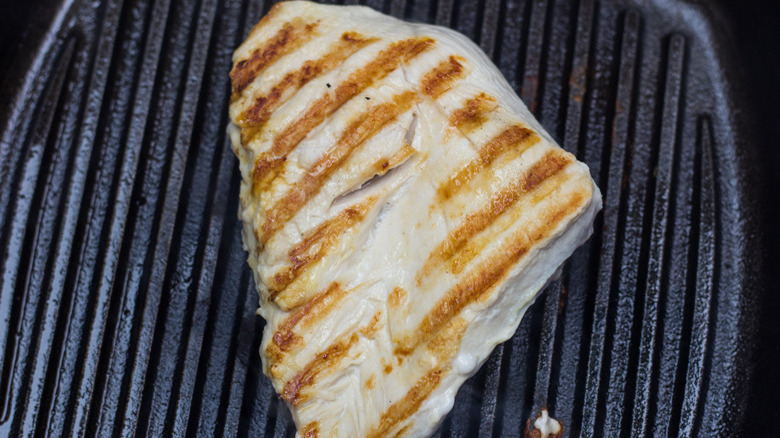 Picture of chicken breast cooking on a grill