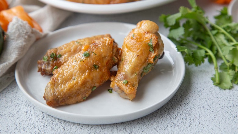 Chicken wings on white plate