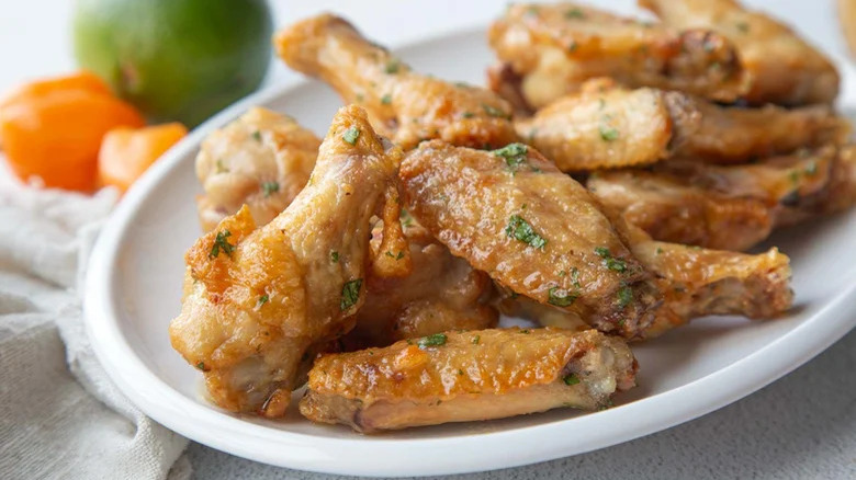 Chicken wings on white plate