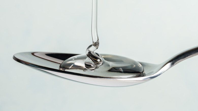 Corn syrup being poured onto spoon