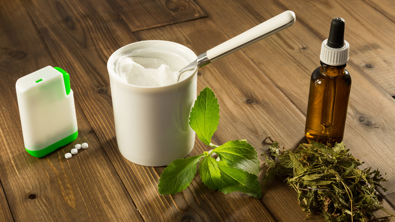 Various forms of stevia: pill, powder, leaf, and liquid