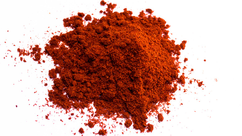 Pile of paprika on a white background 