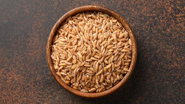 Wood bowl holding uncooked farro