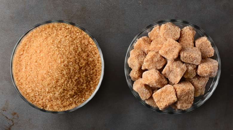 bowl of turbinado sugar next to bowl of brown sugar lumps