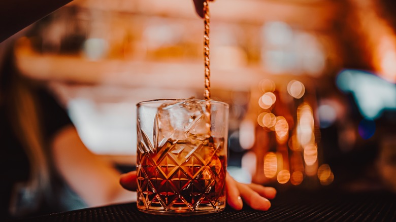 Bartender stirring a cocktail