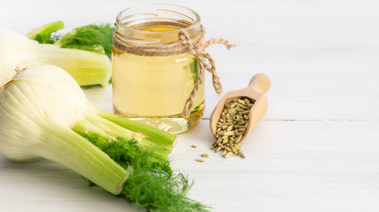 Fennel bulbs and scoop of fennel seeds on counter