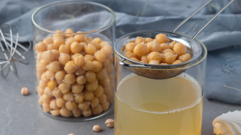 Chickpeas being strained for their aquaphaba