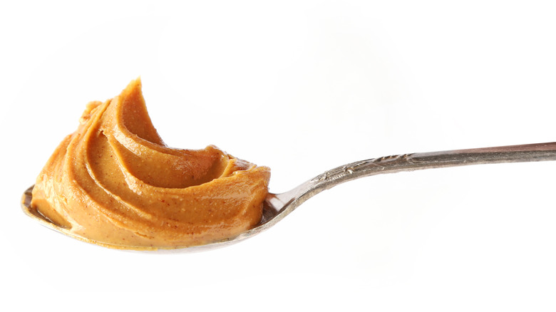 A spoon of peanut butter