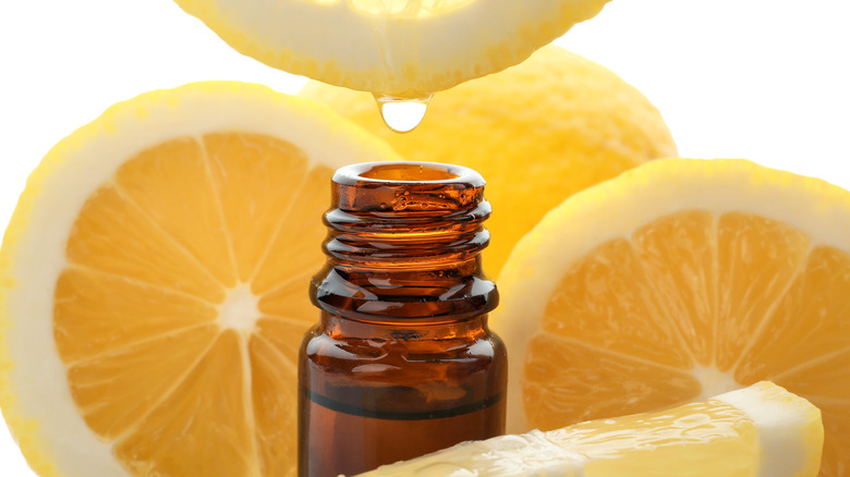 The liquid of a lemon dripping into a small bottle