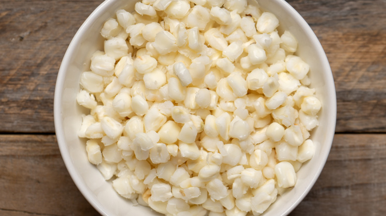 hominy kernels in white bowl