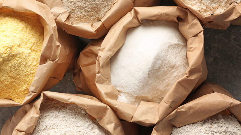 different flour types in brown bags