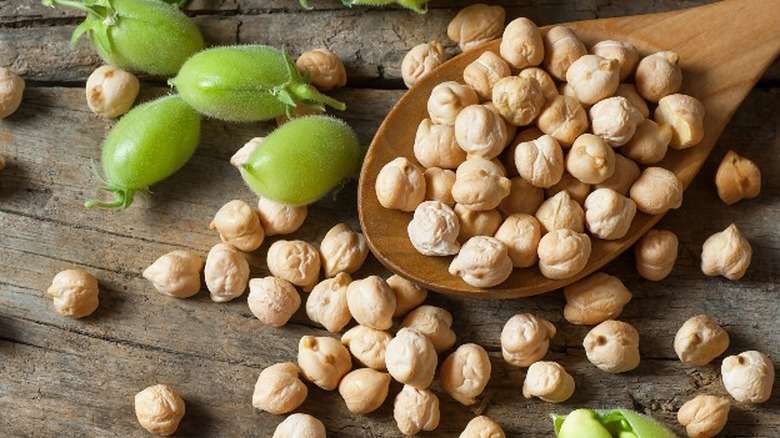 dried Garbanzo beans on wooden spoon