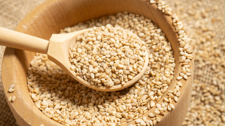 Bowl and spoon of sesame seeds