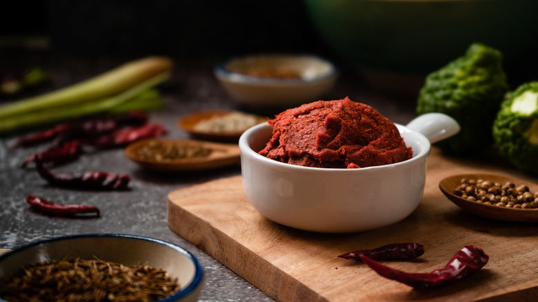 Red curry paste in a white bowl