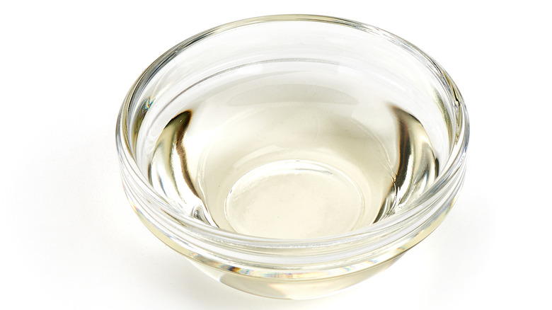 A cup of white vinegar