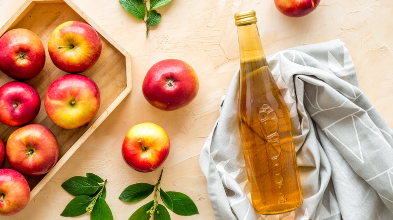 Apple cider vinegar with apples