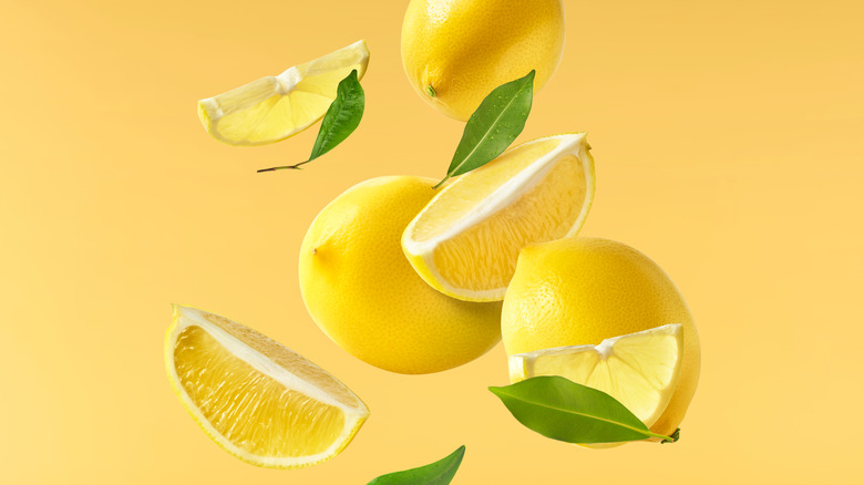 Sliced lemons on a yellow background