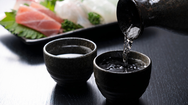 Sake poured into cups