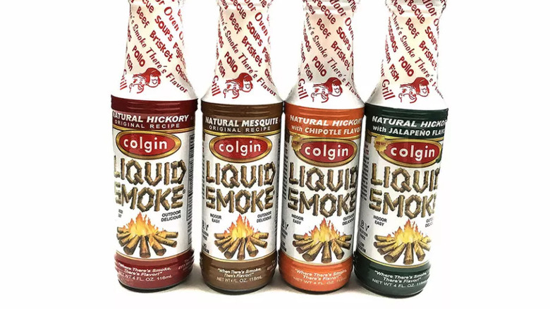 four bottles of liquid smoke