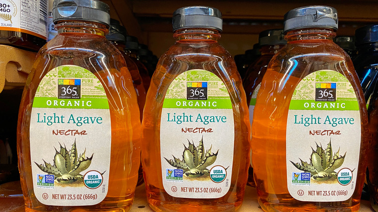 Bottles of agave nectar on a shelf