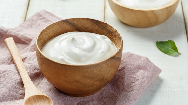 wood bowl of greek yogurt
