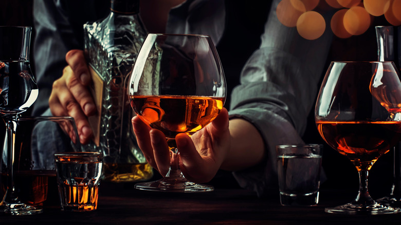 Glasses of brandy being served