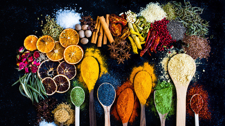 A variety of spices on a black background