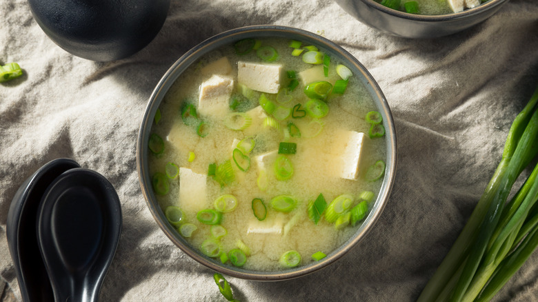 A bowl of miso soup with tofu