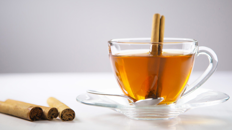 A cup of tea with cinnamon sticks