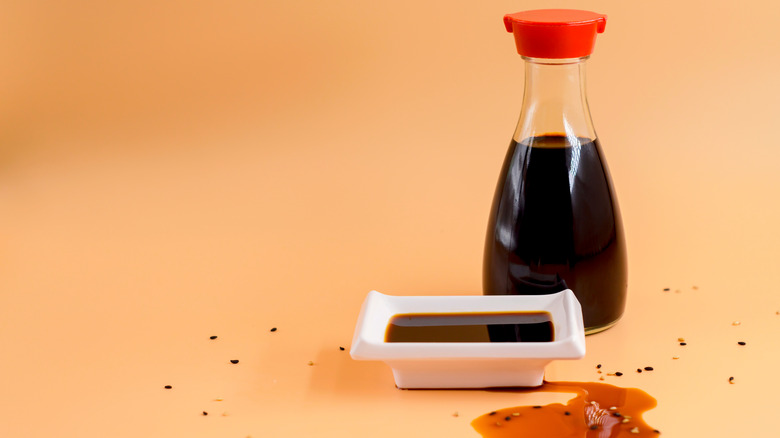 A bottle and bowl of soy sauce