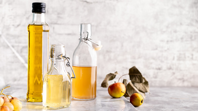 Various white vinegars on marble table