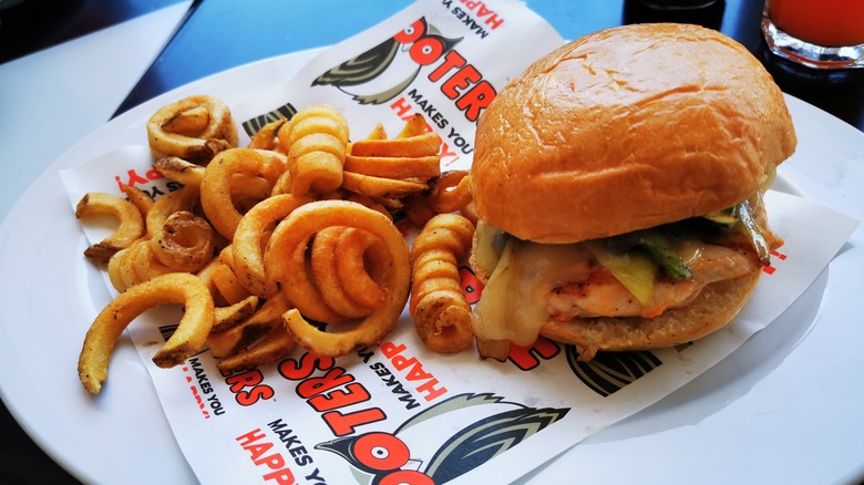 Burger and fries on a plate at Hooters