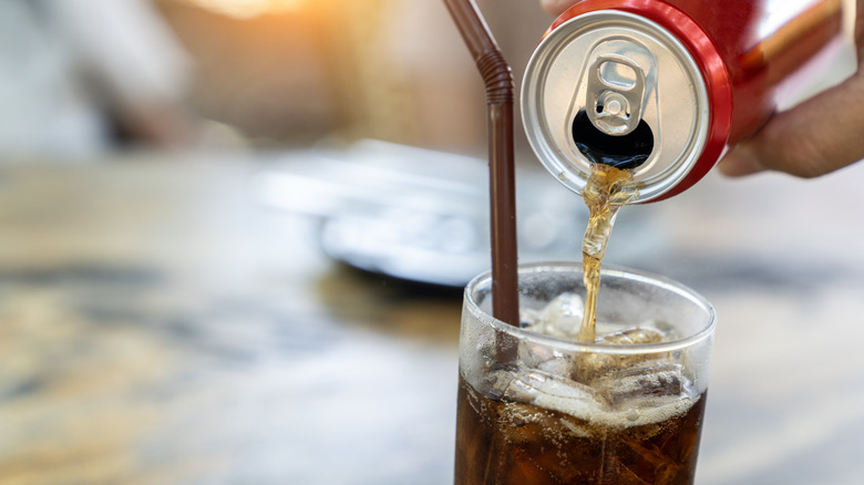 Soda being poured into glass