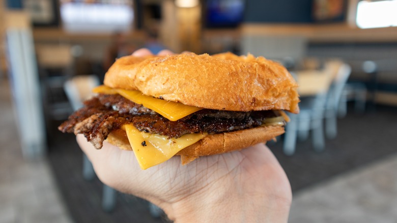 Culvers ButterBurger in hand