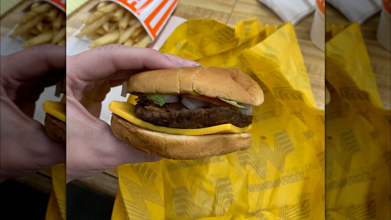 hand holding Whataburger Junior