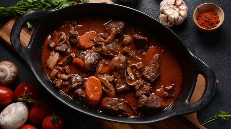 Stew with meat and carrots and mushrooms