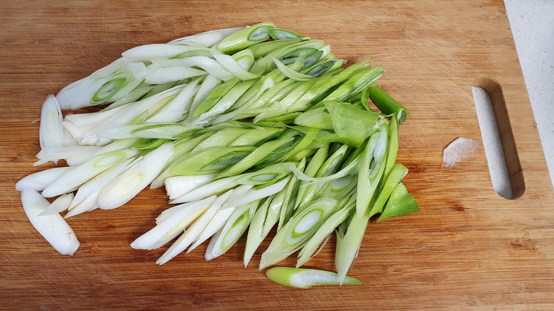 Green onions on a cutting board