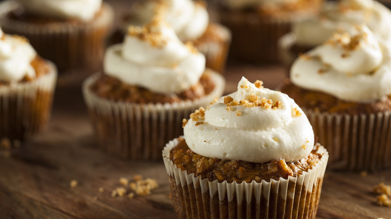 Carrot muffins with frosting and nuts