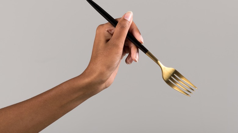 woman holding fork