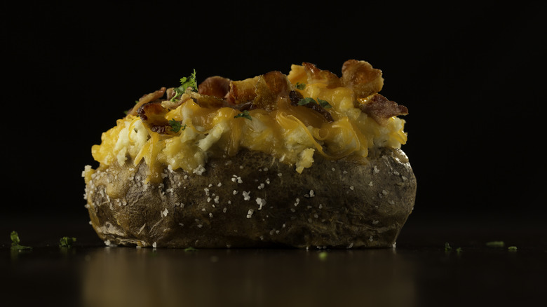 Baked potato with cheese and bacon topping