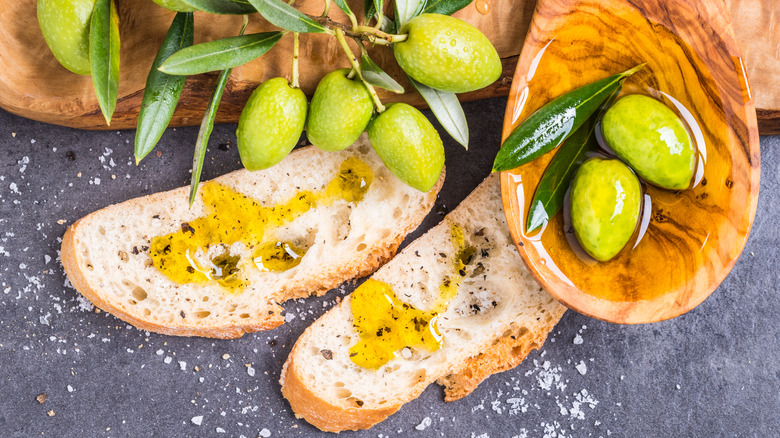 olive oil on bread with fresh olives