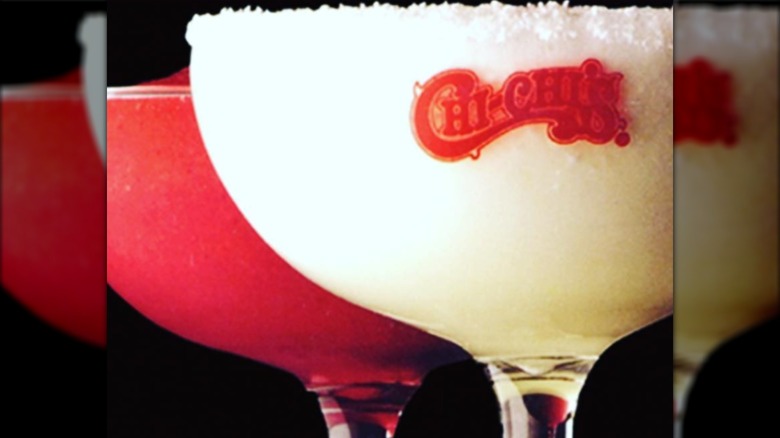 Two frozen drinks in glasses with the Chi-Chi's logo