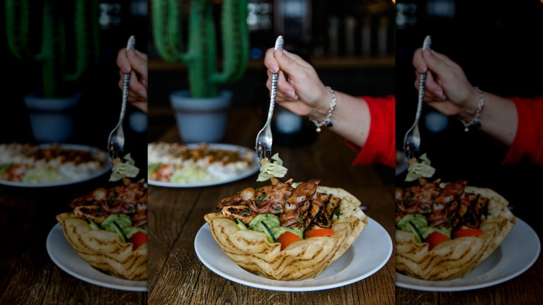 A forkful of Chi-Chi's Taco Salad