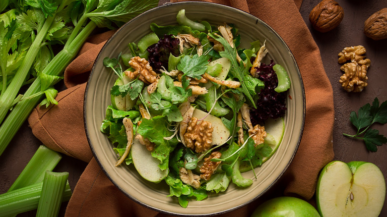 bowl full of apple and walnut salad