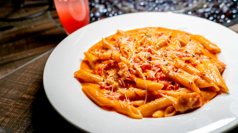 Plate of penne alla vodka in white bowl